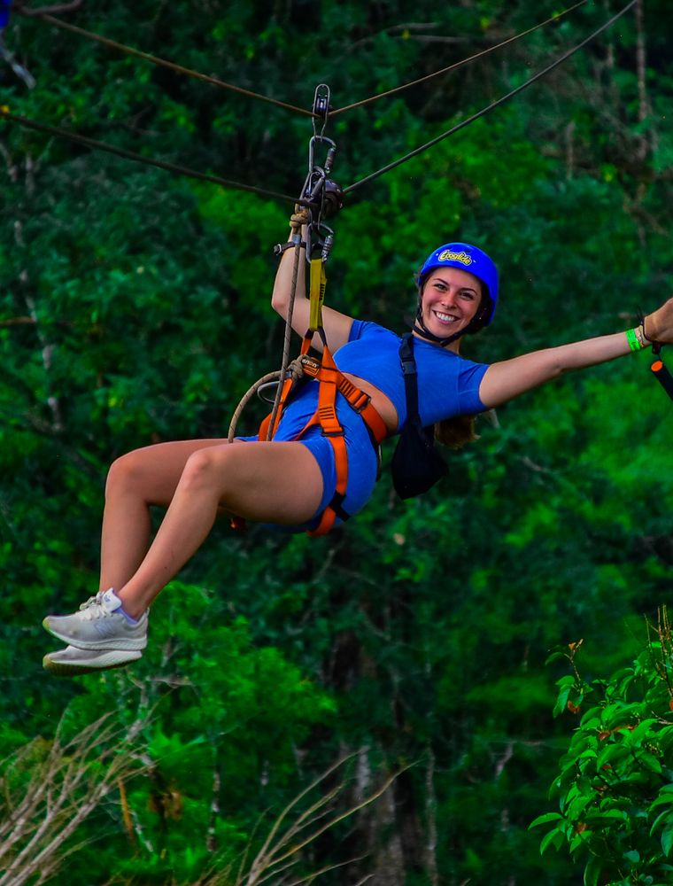 Ziplining over the rainforest canopy near Arenal Volcano